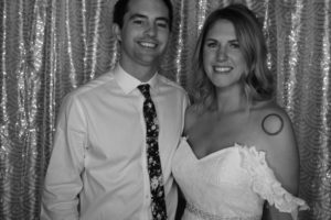 black and white photo of groom and bride in wedding photo booth rental