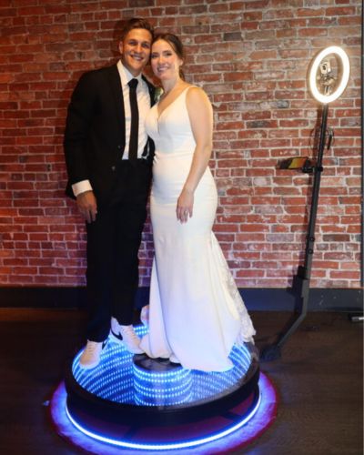 bride and groom on 360 video photo booth rental